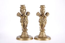 A PAIR OF FRENCH GILT-BRASS FIGURAL CANDLESTICKS, 19TH CENTURY