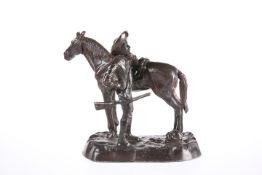 A BRONZE GROUP OF A TROOPER AND MARE