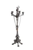 A CONTINENTAL PATINATED BRONZE FOUR LIGHT CANDELABRUM IN THE EMPIRE TASTE