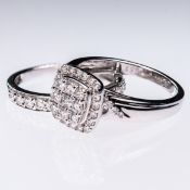A 9CT WHITE GOLD AND DIAMOND CLUSTER RING