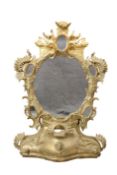 A ROCOCO REVIVAL CARVED AND GILDED MIRROR