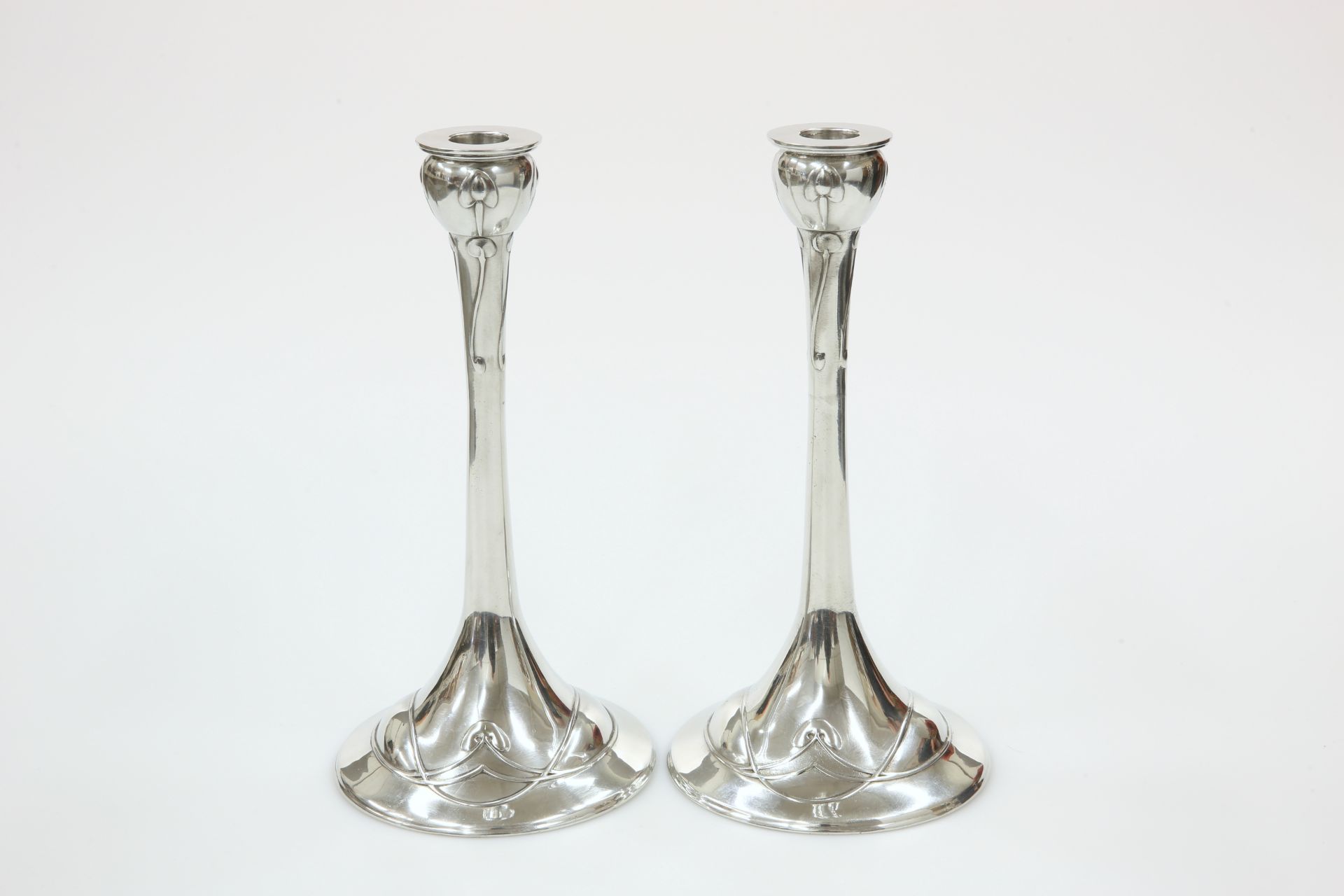 A RARE PAIR OF LIBERTY & CO ENGLISH PEWTER CANDLESTICKS