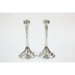 A RARE PAIR OF LIBERTY & CO ENGLISH PEWTER CANDLESTICKS