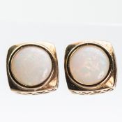 A PAIR OF 9CT YELLOW GOLD AND OPAL STUD EARRINGS