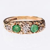 AN EMERALD AND DIAMOND RING