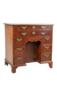 A GEORGE III MAHOGANY KNEE HOLE DESK