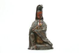 A 19TH CENTURY CHINESE CARVED AND LACQUERED FIGURE OF QUAN YIN