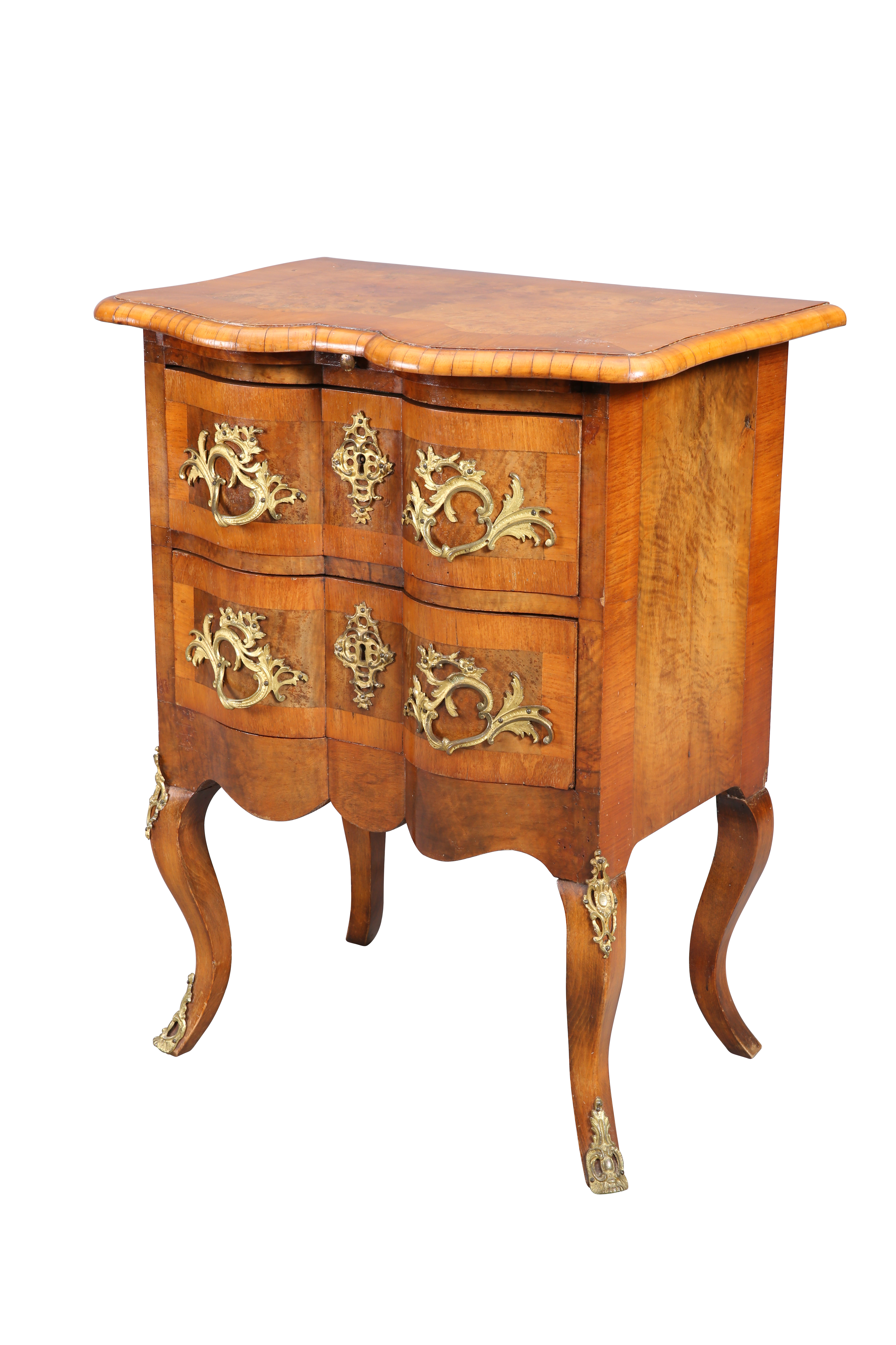 A CONTINENTAL WALNUT COMMODE