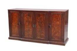 AN EARLY 19TH CENTURY MAHOGANY BREAKFRONT SIDE CABINET