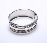 A VICTORIAN SILVER BANGLE, BIRMINGHAM 1882