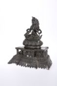 A SINO-TIBETAN BRONZE FIGURE OF A SEATED DEITY