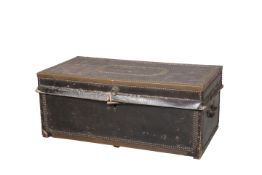 A 19TH CENTURY BRASS-BOUND LEATHER TRUNK