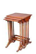 A NEST OF THREE MAHOGANY SPIDER LEG TABLES