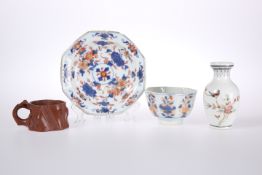 A CHINESE IMARI PALETTE TEA BOWL AND SAUCER