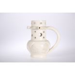 AN EARLY 19th CENTURY CREAMWARE PUZZLE JUG