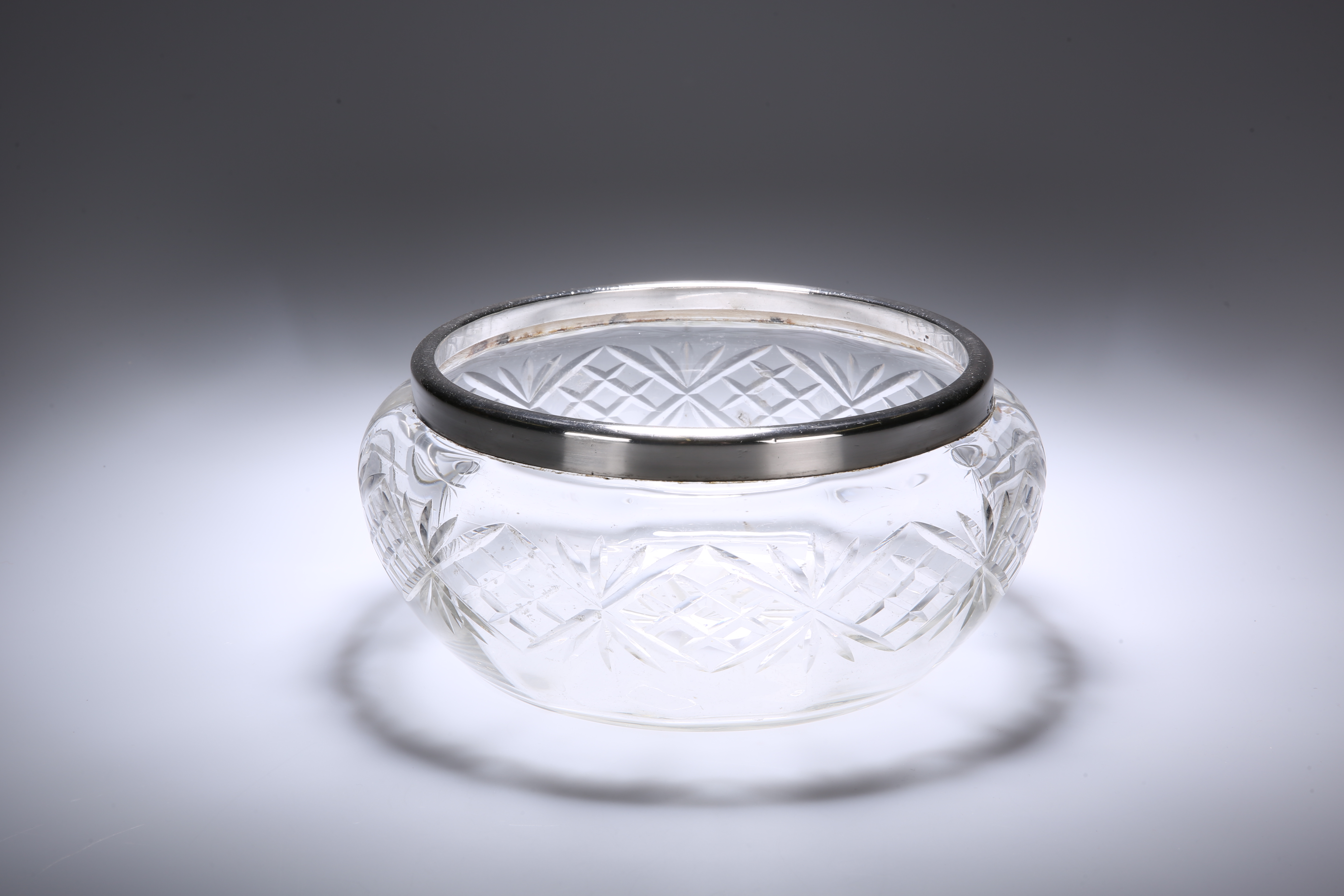 A GEORGE V SILVER-MOUNTED CUT-GLASS FRUIT BOWL