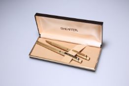 A CASED SHEAFFER GOLD-PLATED FOUNTAIN PEN AND BIRO