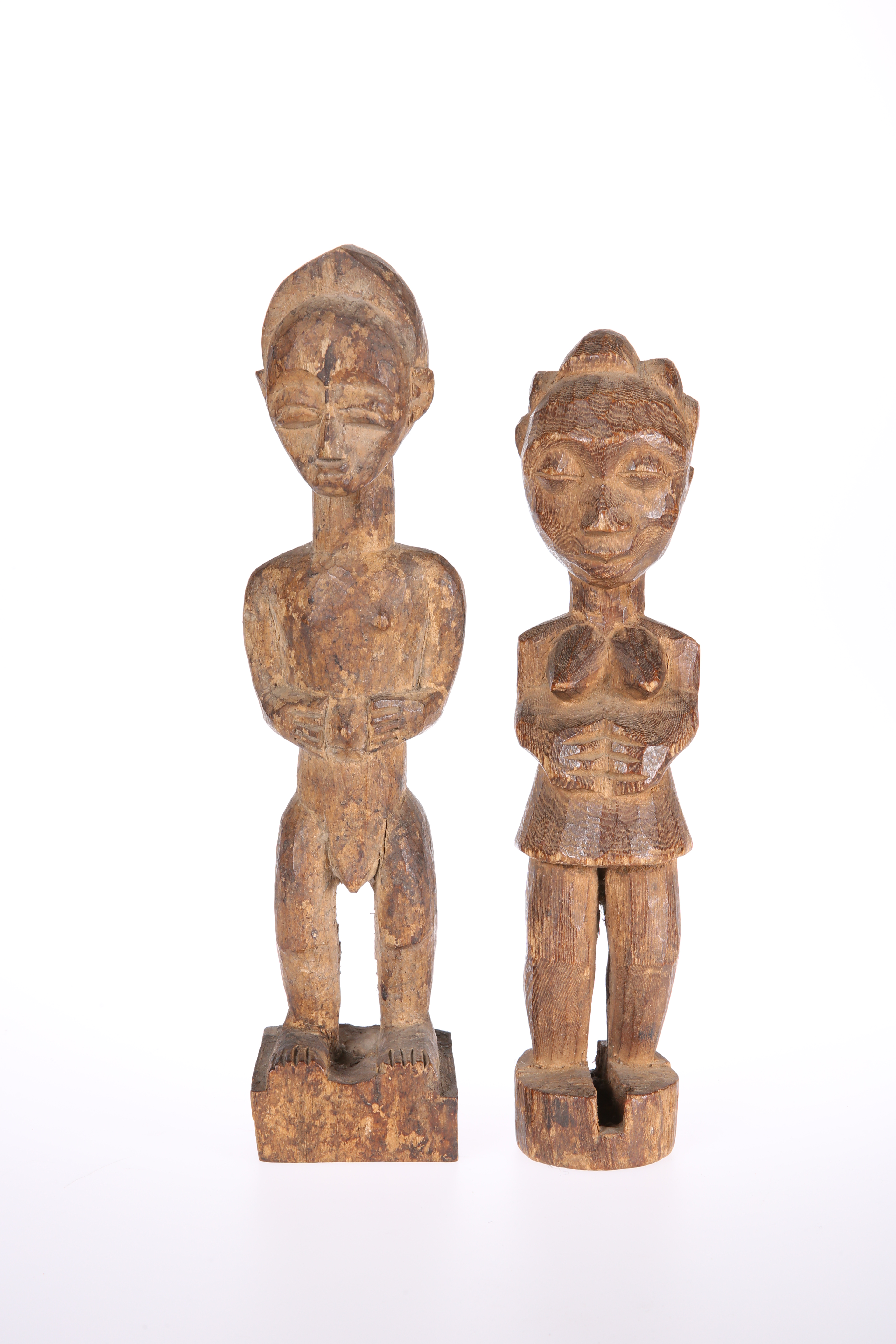 TRIBAL: A PAIR OF CARVED WOODEN FIGURES