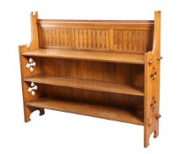 AN ARTS AND CRAFTS OAK OPEN BOOKCASE