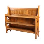 AN ARTS AND CRAFTS OAK OPEN BOOKCASE