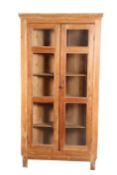 AN EARLY 19TH CENTURY PINE STANDING CORNER CABINET,