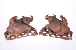 A PAIR OF CHINESE CARVINGS OF RECUMBENT WATER BUFFALO,