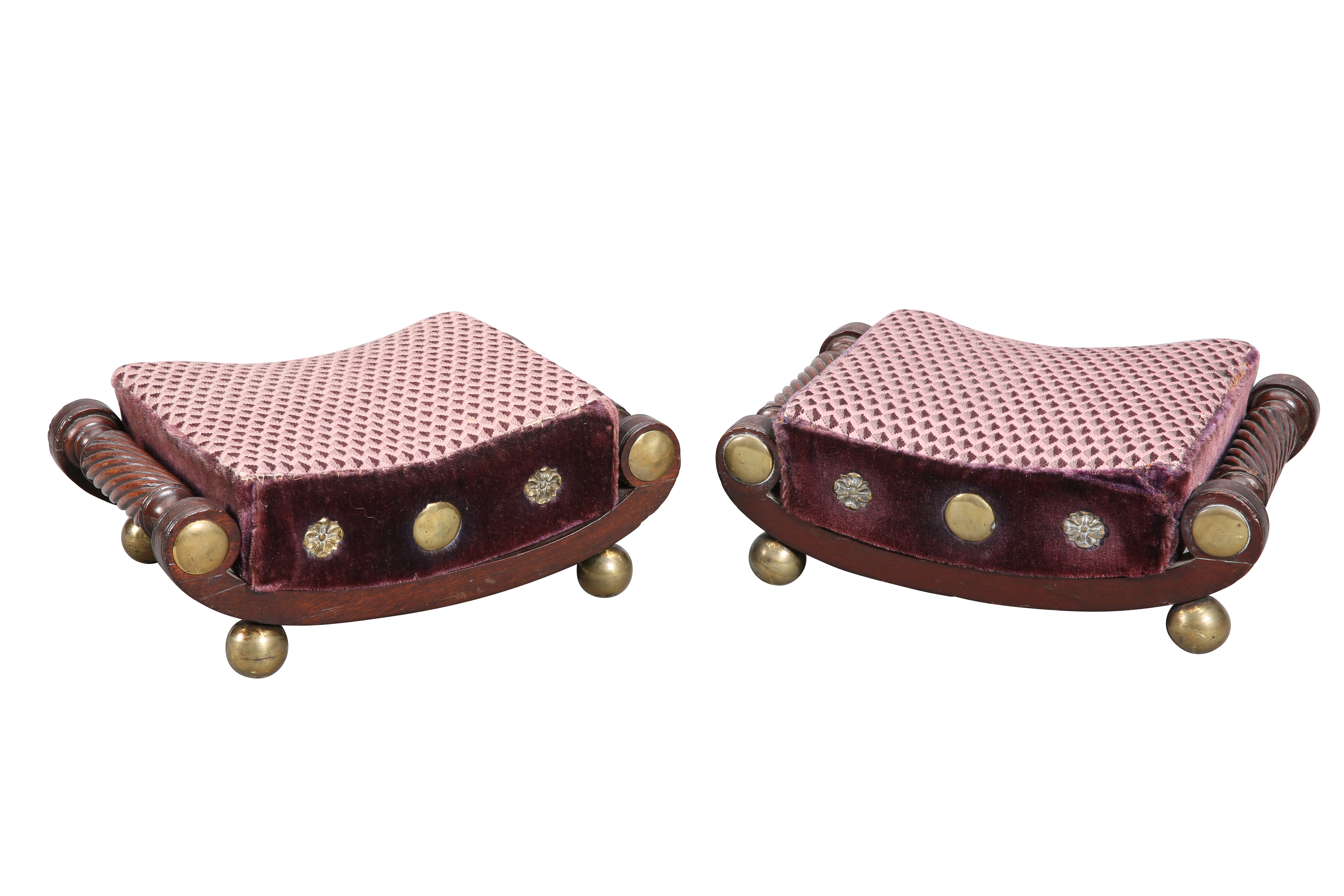 A RARE PAIR OF REGENCY CURVED FOOTSTOOLS