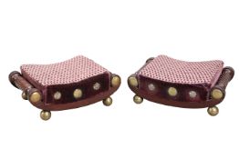 A RARE PAIR OF REGENCY CURVED FOOTSTOOLS