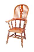 A MID 19TH CENTURY ASH AND ELM BROAD-ARM WINDSOR CHAIR