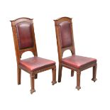 A PAIR OF GLASGOW SCHOOL OAK AND LEATHER HALL CHAIRS