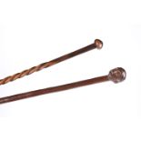 A TRIBAL KNOBKERRIE AND ANOTHER TRIBAL STICK WITH HEAD CARVED HANDLE