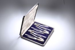 A CASED SET OF FOUR SILVER-PLATED NUTCRACKERS AND PICKS, EARLY 20th CENTURY