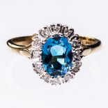 A 9CT YELLOW GOLD, BLUE TOPAZ AND DIAMOND CLUSTER RING