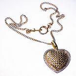 A YELLOW AND WHITE GOLD AND DIAMOND PENDANT OF HEART SHAPE