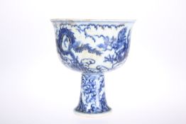 A CHINESE BLUE AND WHITE PORCELAIN STEM CUP