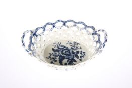 A FIRST PERIOD WORCESTER BLUE AND WHITE PINE CONE PATTERN BASKET,