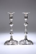 A PAIR OF GEORGE II CAST SILVER CANDLESTICKS, JOHN CAFE, LONDON 1755