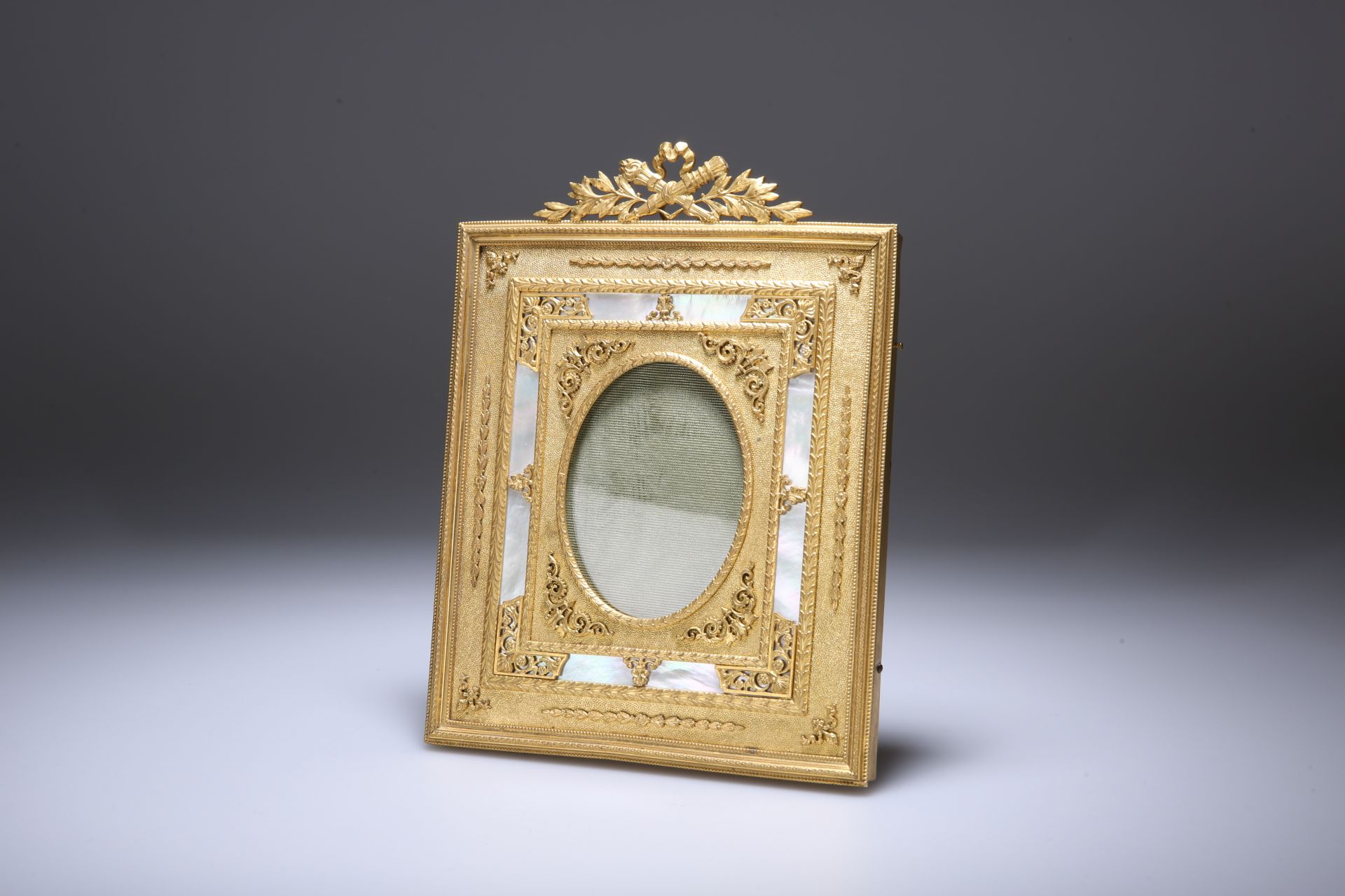 A FINE FRENCH ORMOLU AND MOTHER-OF-PEARL PHOTOGRAPH FRAME