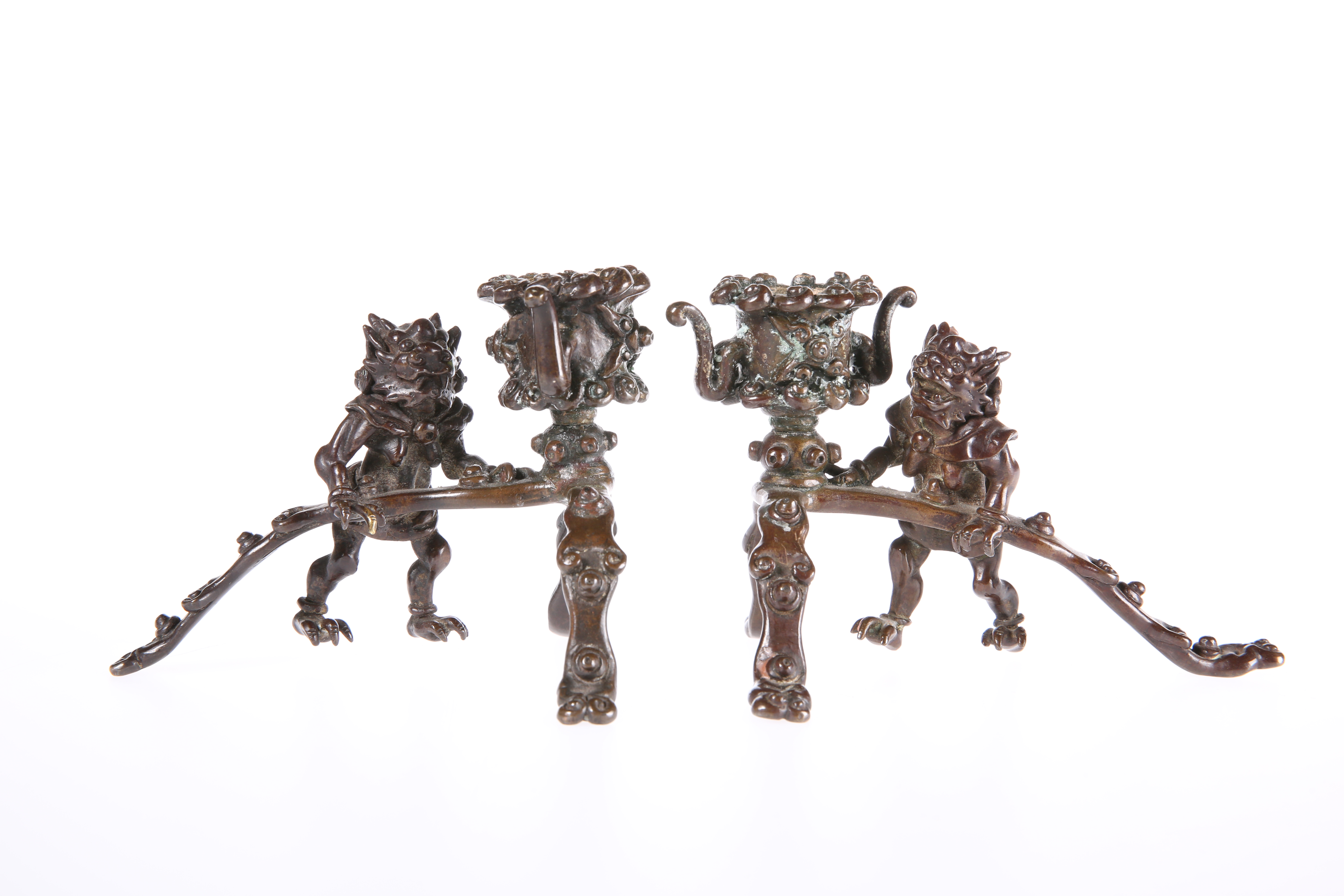 A PAIR OF ORIENTAL BRONZE CANDLESTICKS