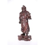 A CHINESE CARVED ZITAN FIGURE