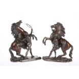 A PAIR OF PATINATED BRONZE GROUPS OF MARLY HORSES, AFTER COUSTOU