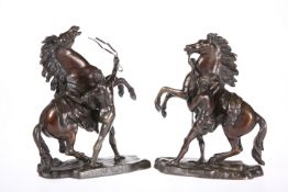 A PAIR OF PATINATED BRONZE GROUPS OF MARLY HORSES, AFTER COUSTOU