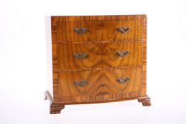 A GEORGE III STYLE MINIATURE CROSSBANDED WALNUT BOW-FRONTED CHEST OF DRAWERS