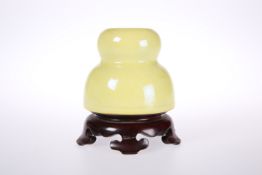 A SMALL CHINESE YELLOW GLAZED GOURD-FORM VASE