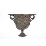 A 19th CENTURY PATINATED BRONZE TWIN-HANDLED CUP OR BOWL