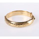 A LATE VICTORIAN GOLD-PLATED BANGLE
