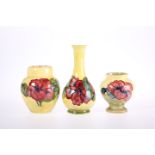 THREE PIECES OF MOORCROFT POTTERY IN THE HIBISCUS PATTERN
