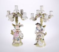 A PAIR OF DRESDEN PORCELAIN FIGURAL FIVE-LIGHT CANDELABRA