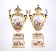 A LARGE PAIR OF DRESDEN YELLOW GROUND VASES, COVERS AND STANDS
