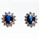 A PAIR OF SAPPHIRE AND DIAMOND STUD EARRINGS